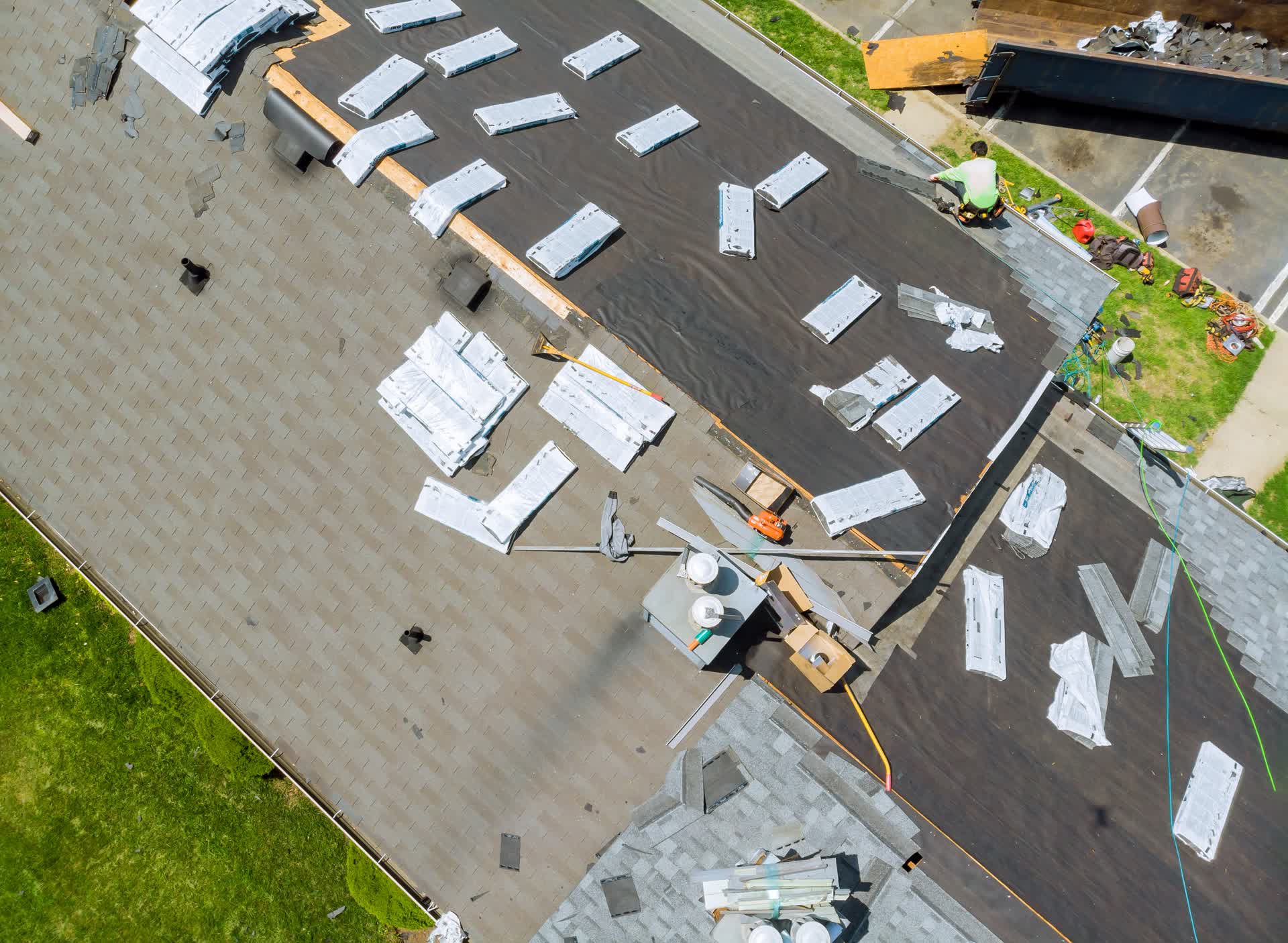 Aerial view of roof repair and replacement in progress