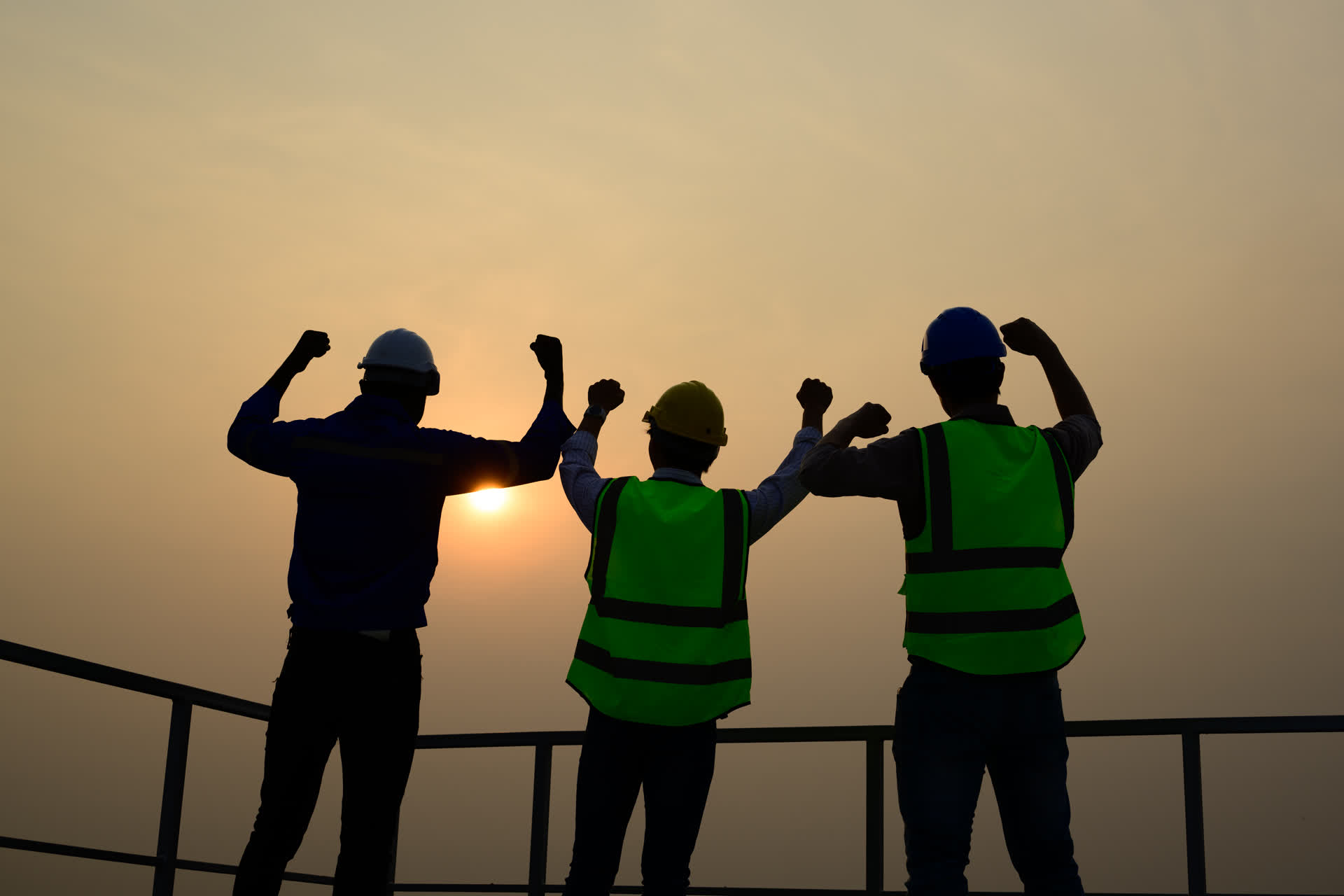 Roofing team standing together at job site