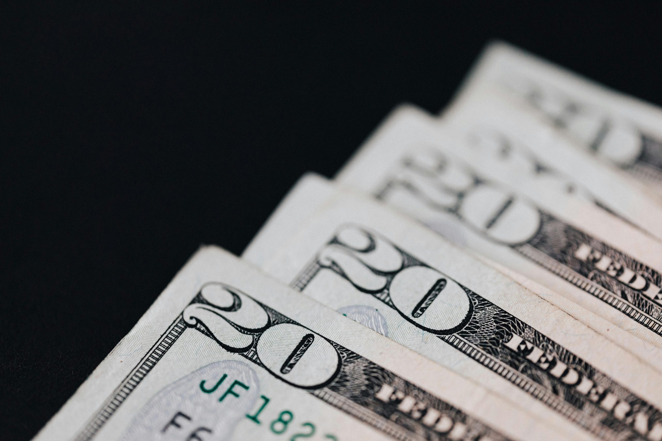 Close-up of cash representing roofing project cost